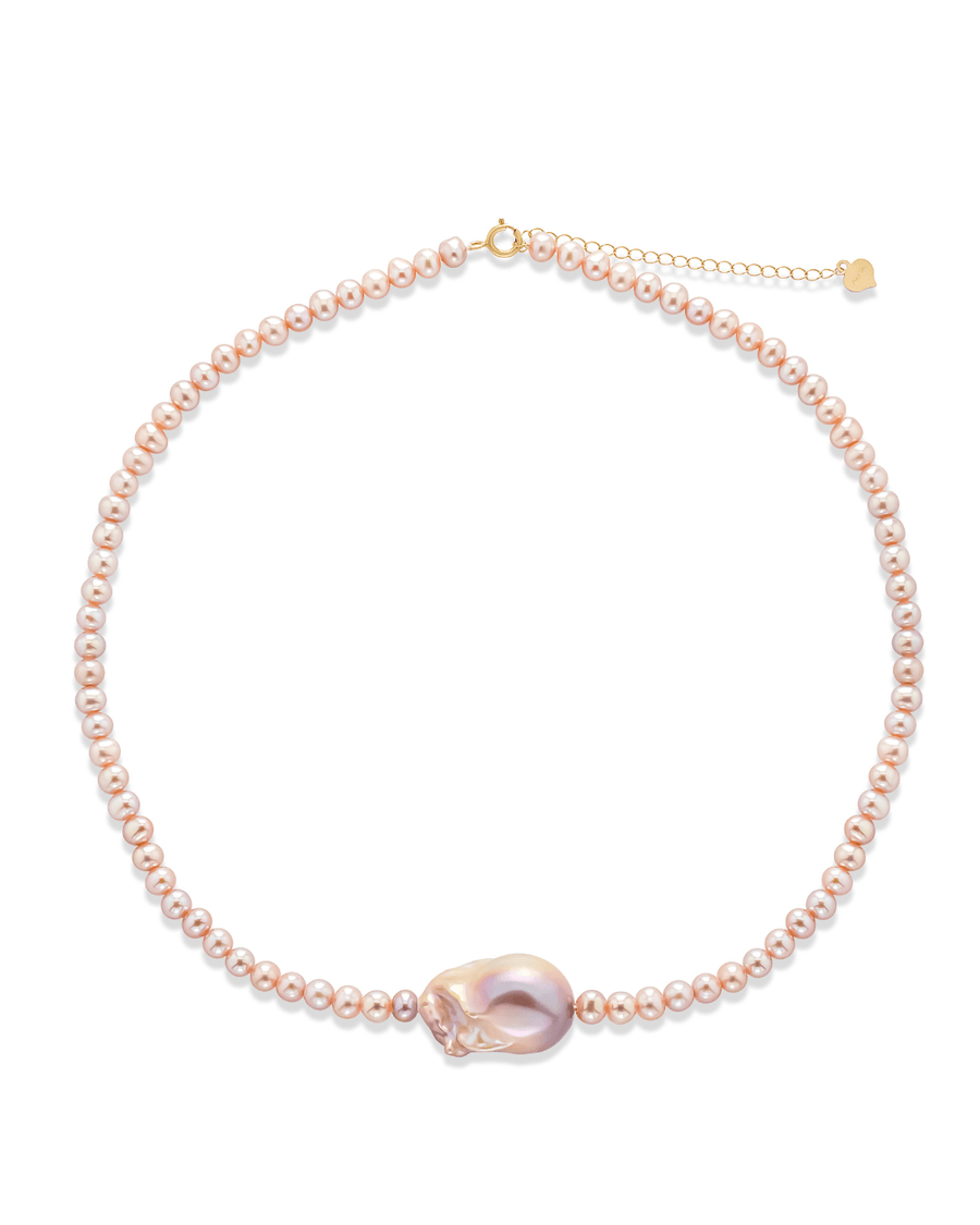 Lavender-colored pearl necklace with baroque pearl centerpiece and gold clasp