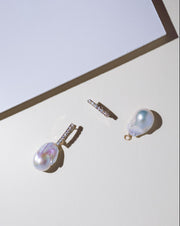The transformable earrings with Baroque pearls and AAA grade Topaz stones