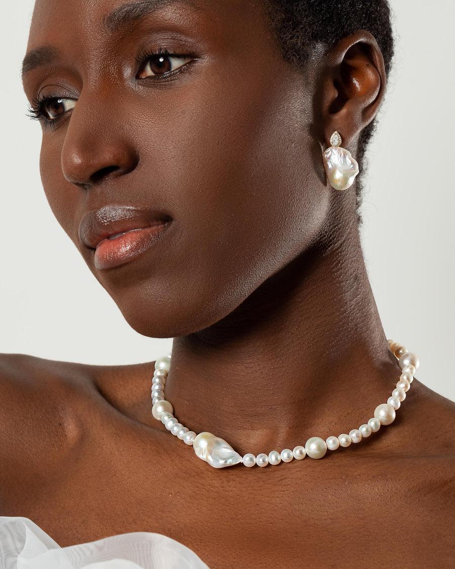  wedding necklace with a baroque pearl centerpiece and smaller freshwater pearls in varying sizes.