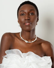 bridal stunning pearl necklace with a baroque pearl centerpiece and smaller freshwater pearls in varying sizes.